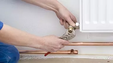 engineer fixing central heating